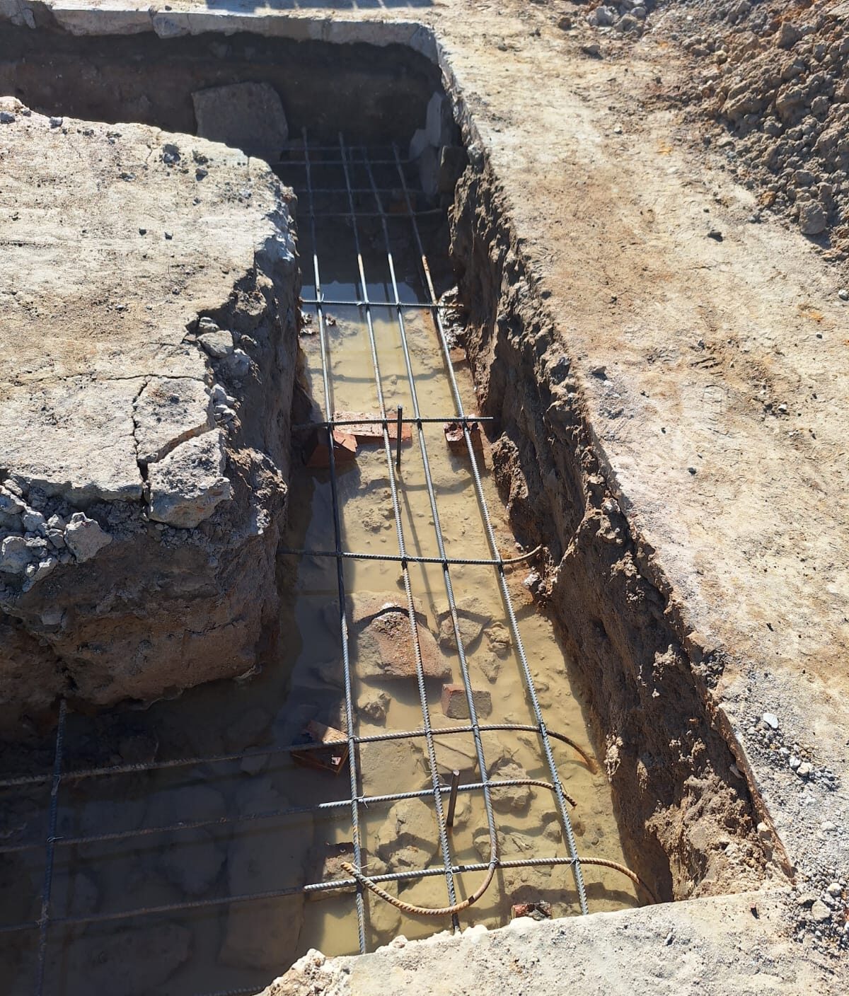 Reinforced foundation trenches on site