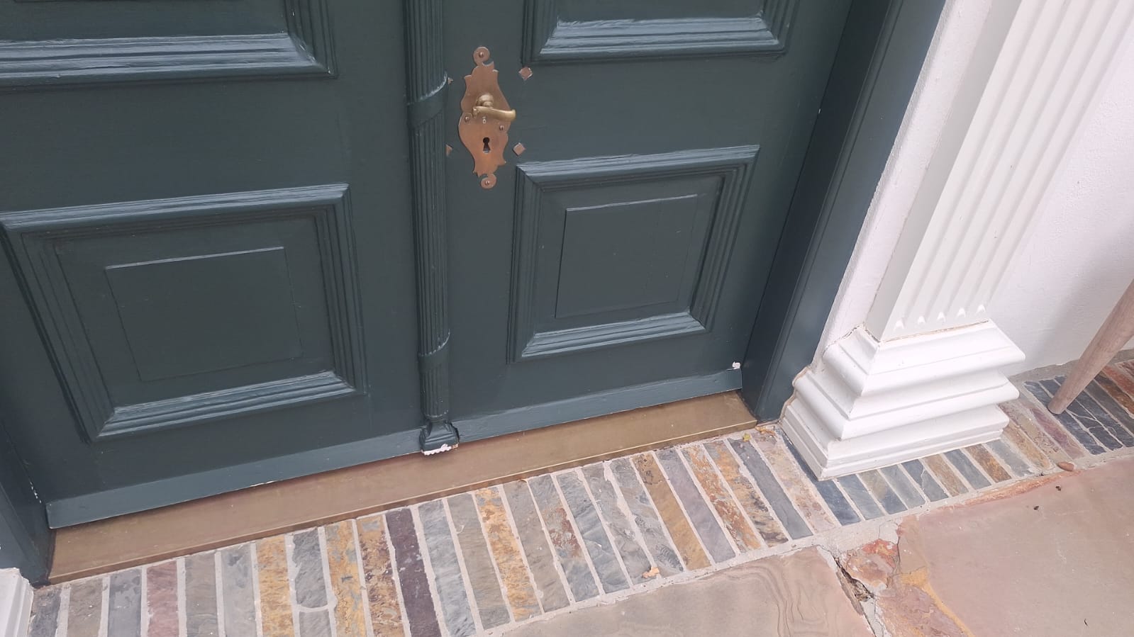 Restored front door with brass hardware