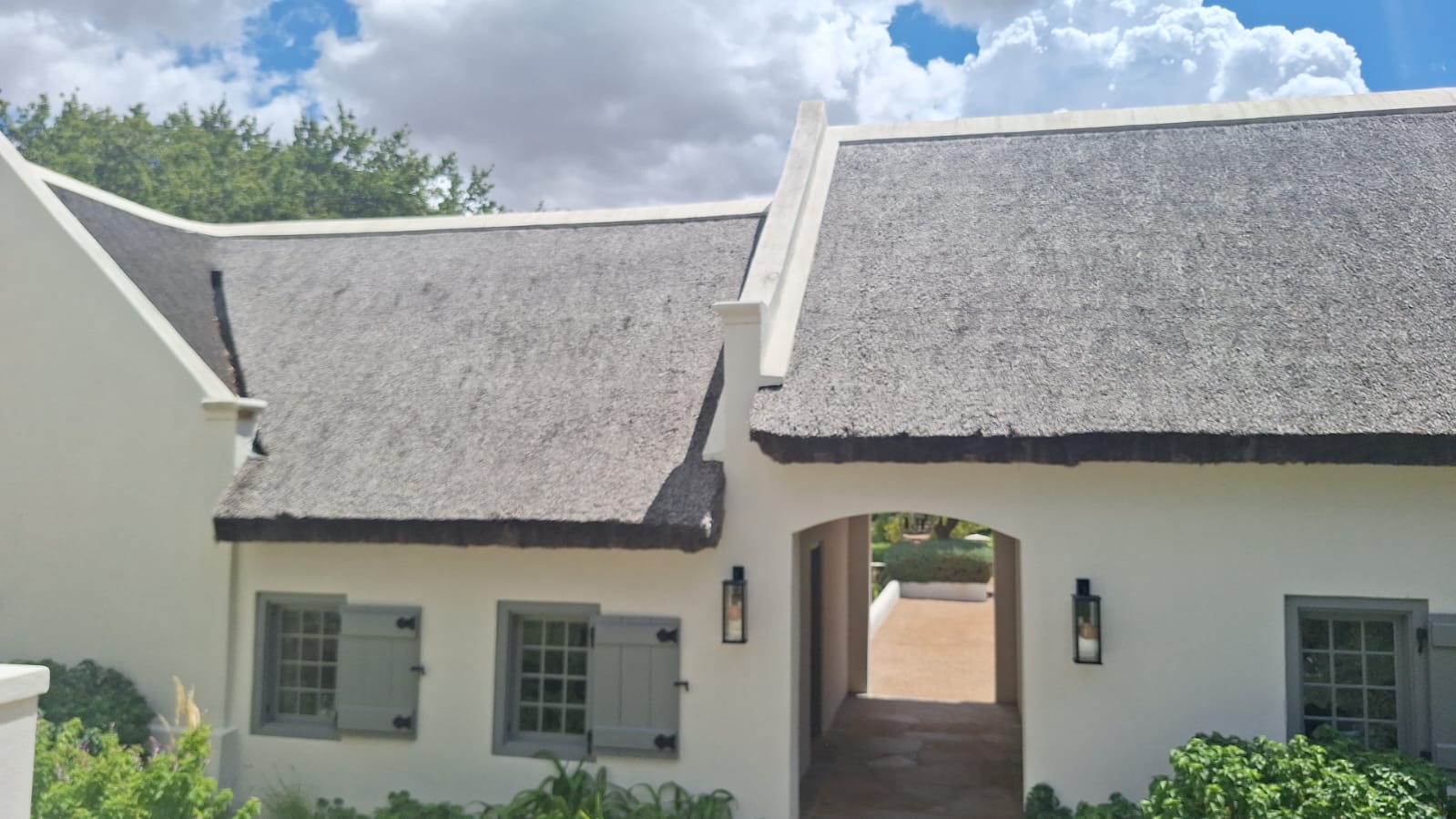Cape Dutch home with arch gateway