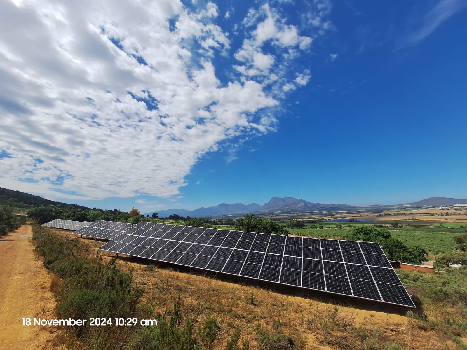 Solar panels with mountain backdrop