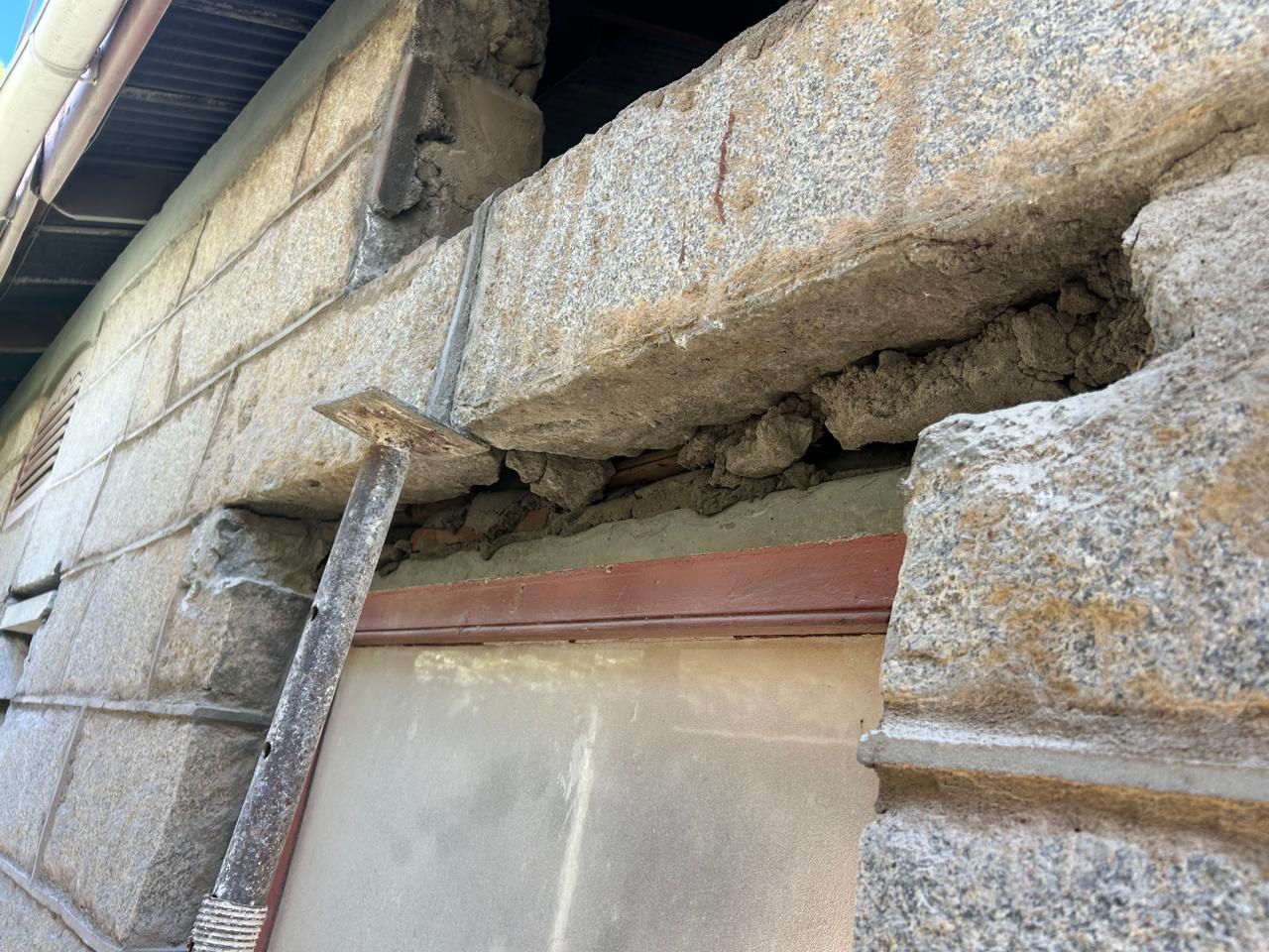 Structural beam work in stone wall